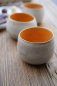 Preview: Keramik Kaffeebecher handgetöpfert– Innen Orange außen Naturweiß mit zarten Sprenkeln